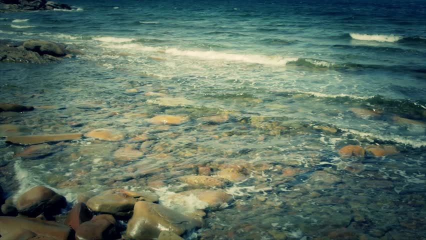 A jib shot of a rocky ocean shoreline