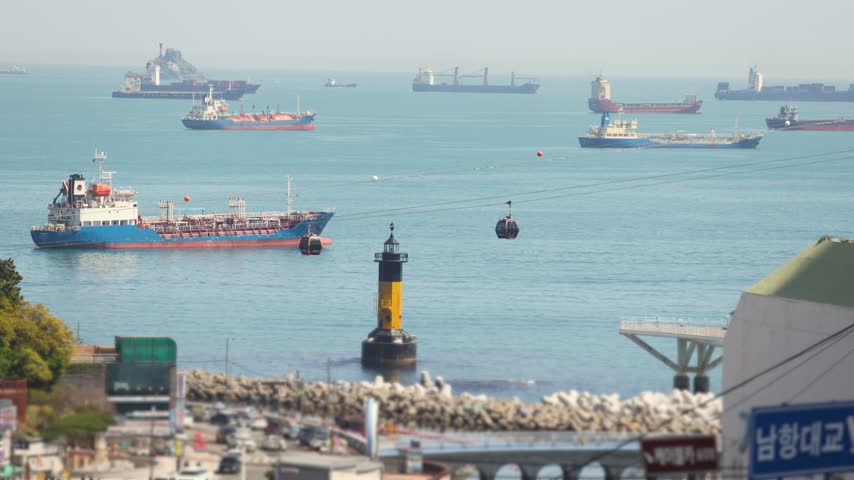 Busan Port and harbor of Busan, South Korea, container terminal with gantry cranes, cargo ships at anchor, shipyard docks, fishing boats and ferry terminal between Jung-gu, Nam-gu and Yeongdo island