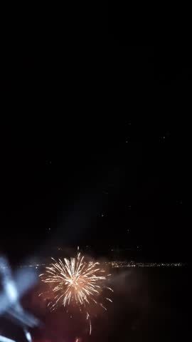 Spectacular fireworks explode above Nafpaktos harbor in Greece during a nighttime reenactment of the historic Battle of Lepanto. Bright pyrotechnic effects, drifting smoke, colorful lights and illuminated historic-style ships create a dramatic maritime spectacle. The waterfront buildings and gathered spectators capture the atmosphere of a traditional cultural event celebrating Greek history and heritage. Suitable for travel documentaries, tourism videos, historical programs and cultural event productions.
