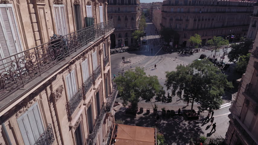 High angle view of historic Haussmann-style building facade and street intersection in Marseille, France