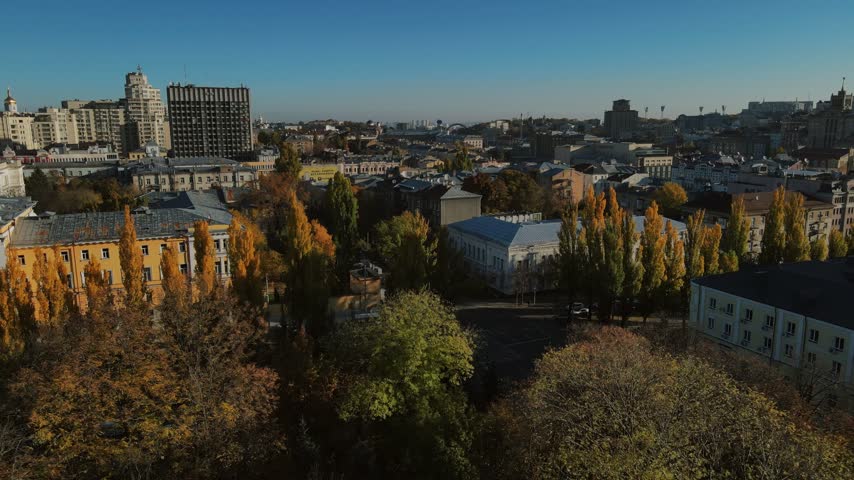 Aerial view over autumn trees and historic rooftops in downtown Kyiv, Ukraine