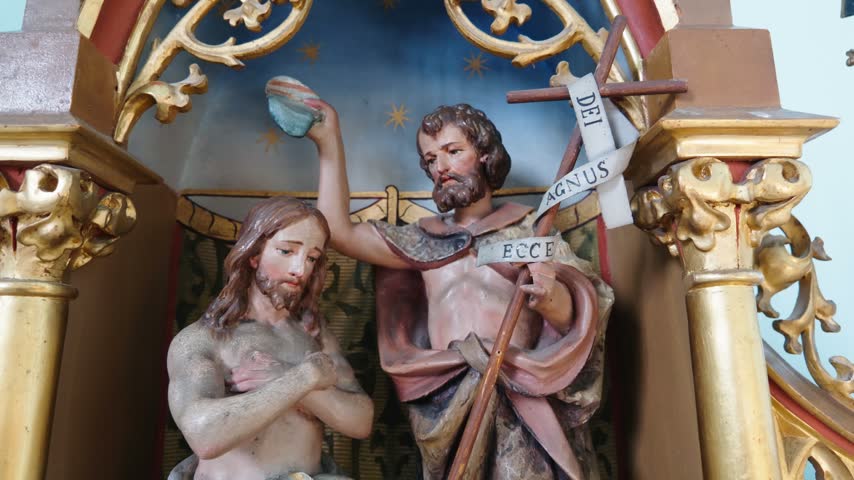 Close view of detailed religious artwork and painted figures inside a traditional church in Cacica, Romania.