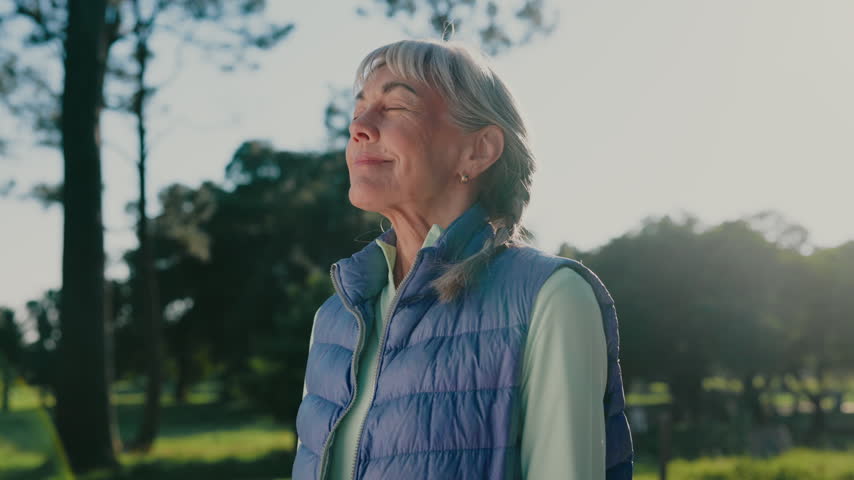 Thinking, smile and old woman in park with breathing, daydream and nostalgia in calm mindset. Retirement, flare and elderly person with fresh air, flashback and peaceful perspective in nature.