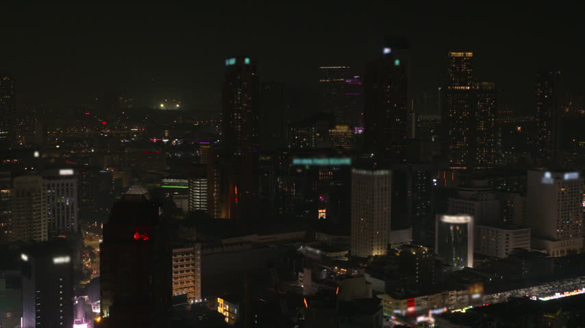 Kuala Lumpur city skyline at night viewed from a high vantage point, Malaysia