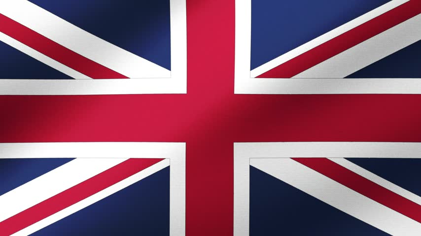 United Kingdom flag waving proudly in the bright sunlight