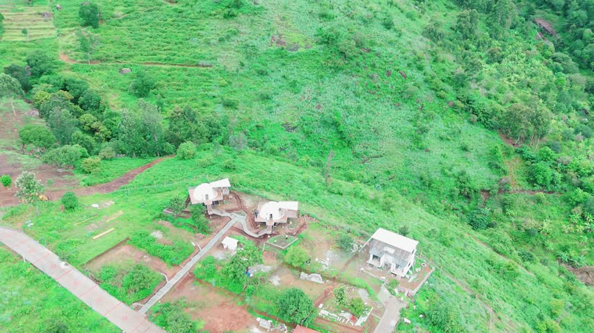 Aerial View of Hillside Settlement Surrounded by Green Mountains in Nilgiris, India