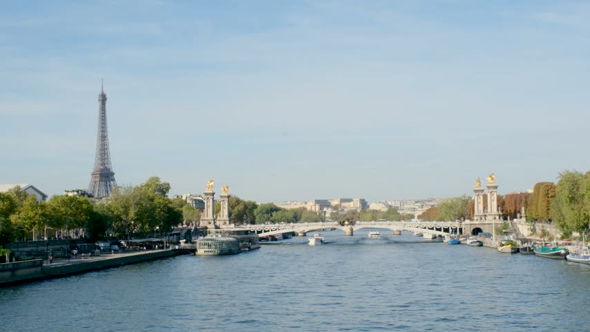 Experience the enchanting beauty of Pont Alexandre Bridge as it gracefully spans the Seine River in Paris, France.