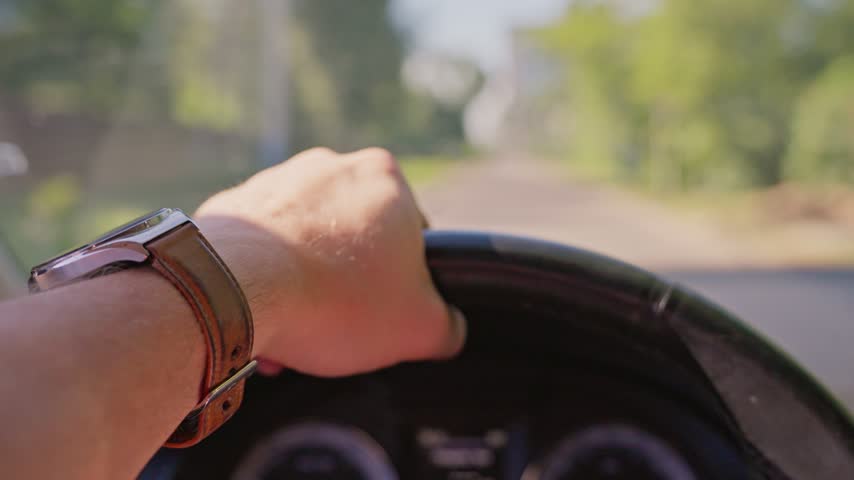 A man is driving a car	
