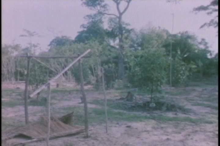1960s - A group of soldiers search for Vietcong troops in a Vietnamese village during the Vietnam War