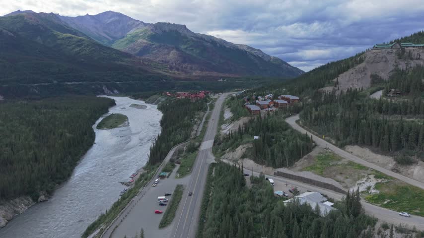 Aerial view of the highway leading to Denali National Park entrance surrounded by mountains in Alaska, USA. July 14, 2025. 