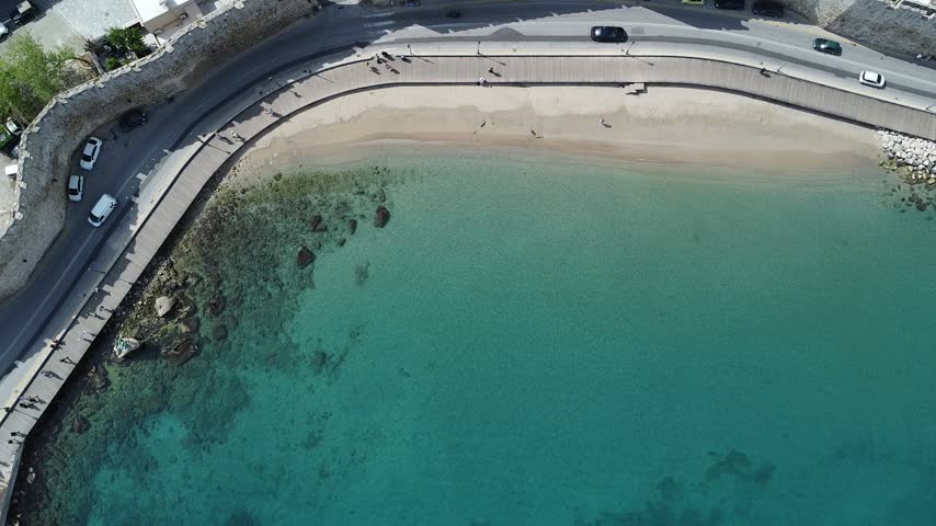 Small bay with a breakwater and clear water from above, Rhodes town, Greece
