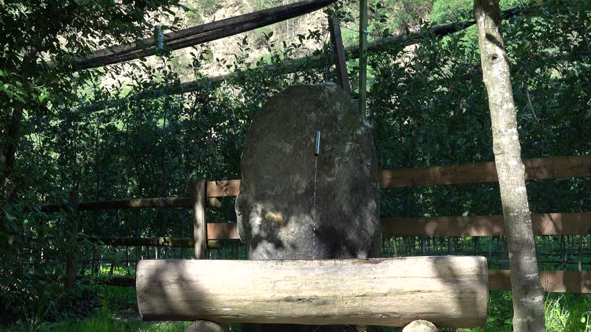 A drinking fountain along a hiking trail trickles gently