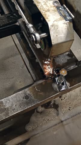 Close up of lathe tool post and turning steel part