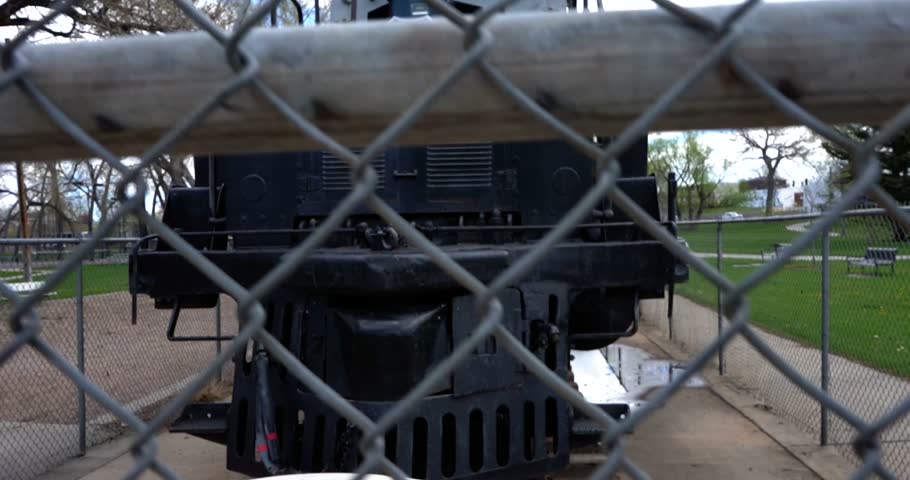 Big Boy steam locomotive seen through chain link fence in Cheyenne, Wyoming