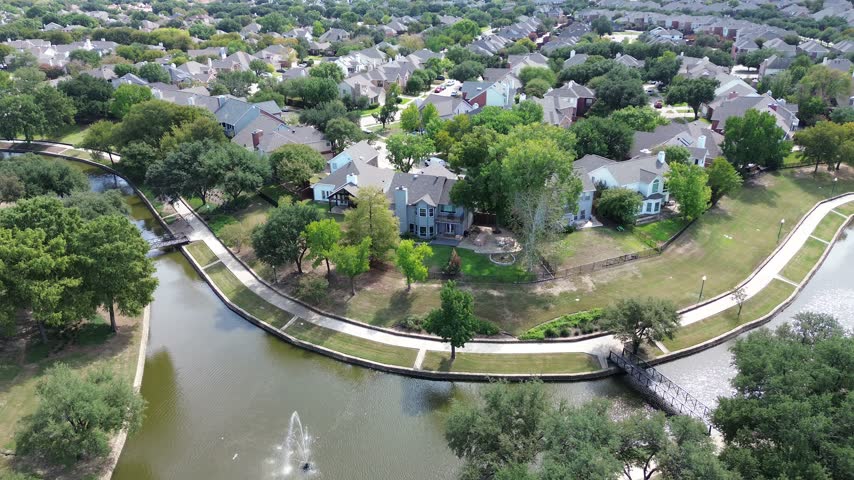 Splendid waterways traverse zones, displaying pristine aquatic channels along Valley Ranch Marina. Neat gardens adorn suburban properties, offering stunning regional aesthetics, Irving, Texas. USA.