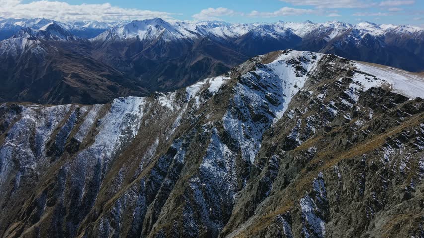 Aerial view of rugged snow-capped peaks in Central Otago, South Island, New Zealand