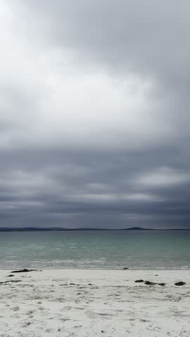 Storm clouds gather over Dogs Bay in Galway as the beach and bay sit under changing coastal light.