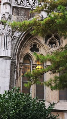 Detailed view of a Gothic window facade of Vajdahunyad Castle in Budapest