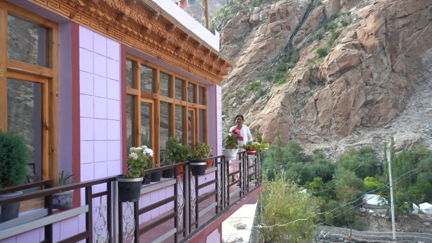 Woman at The Gallery of house