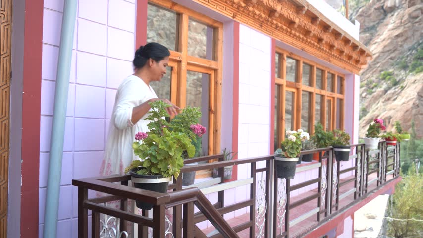 Woman at The Gallery of house