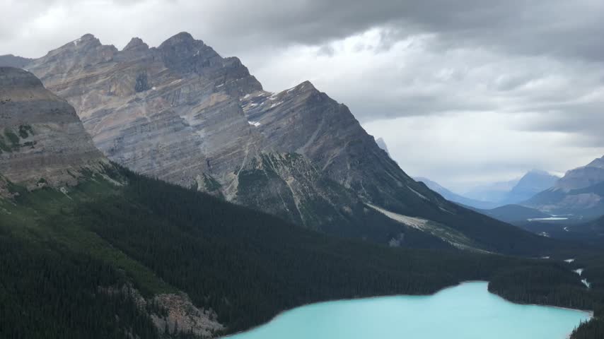 Peyto Lake and forested mountain slopes in Banff National Park, Canada.