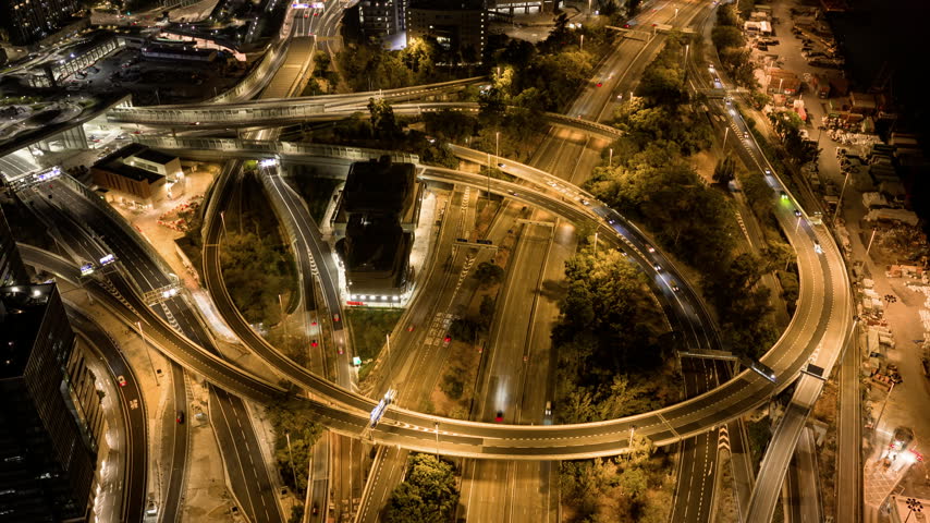 night time illumination flight over hong kong city kowloon bay traffic road interchange aerial topdown panorama 4k timelapse