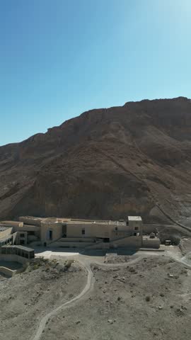 masada national park visitor center and snake path vertical aerial drone shot