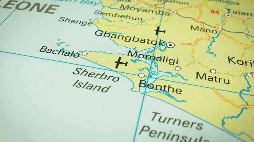 Sierra Leone – flyover across the country toward Freetown on a printed map