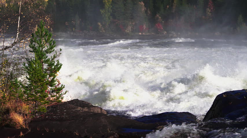 Turbulent water of the Storforsen rapids, one of Europe