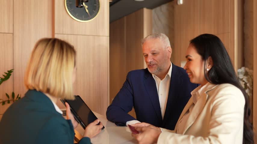 Business interaction with an Asian woman at a stylish reception area