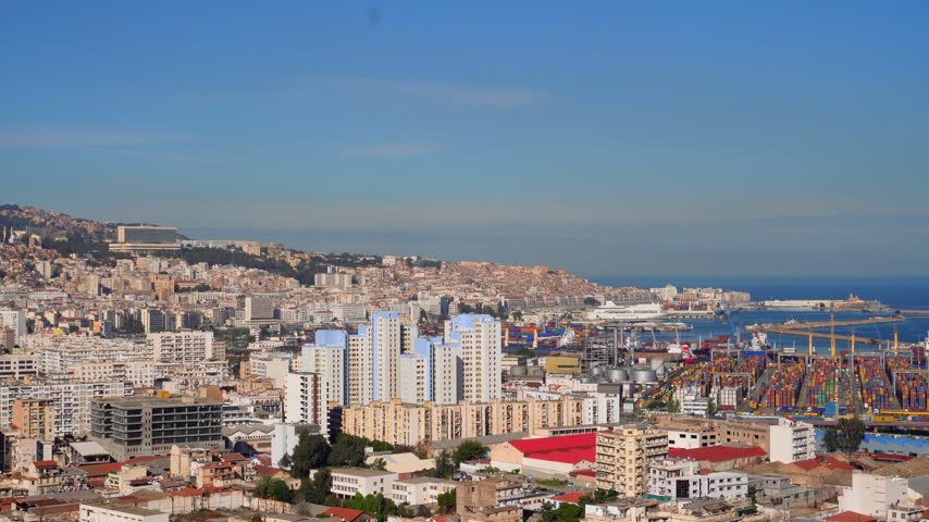 Alger the capital city of Algeria, North Africa, city centre of Algiers, the capital of Algeria, Landscape of Algiers city With port and Mediterranean sea and white buildings, Arab Maghreb Africa.