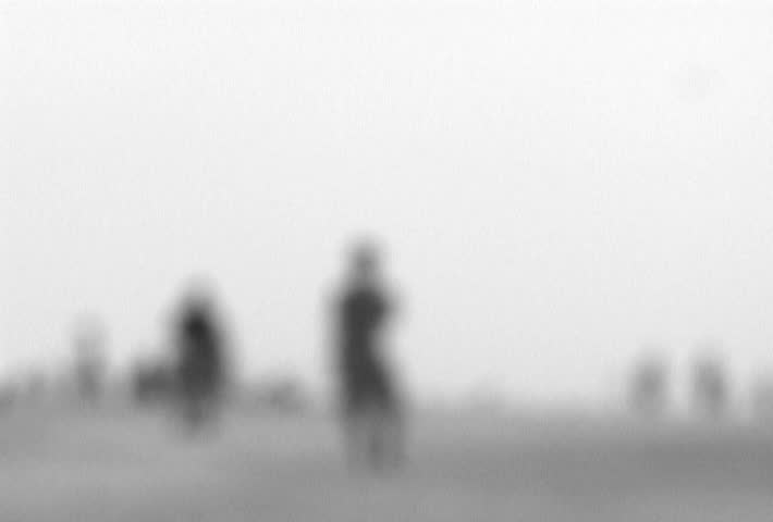 People at beach blurred for concept.