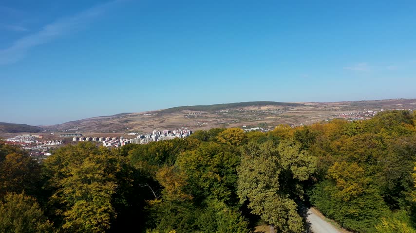  Aerial view of autumn hills and urban cityscape, Cluj Napoca, Romania