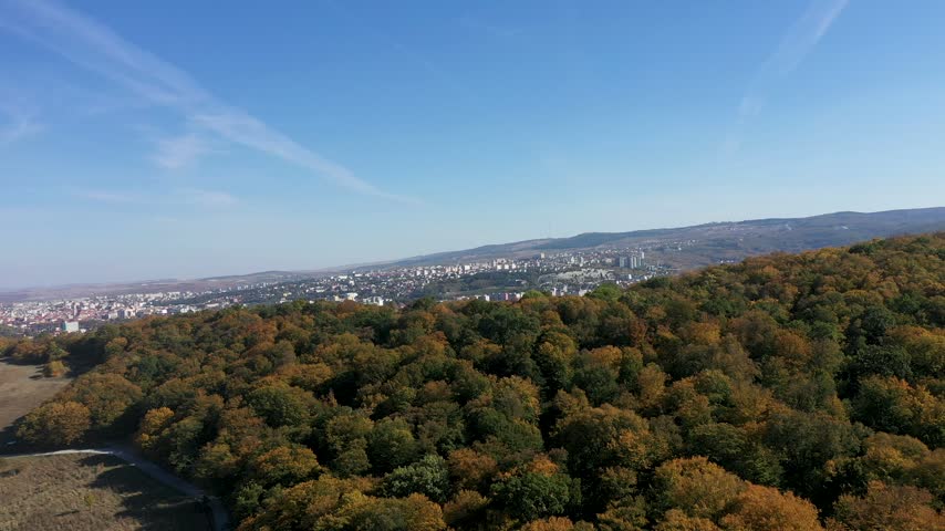  Panoramic overlook of colorful autumn trees and urban area 