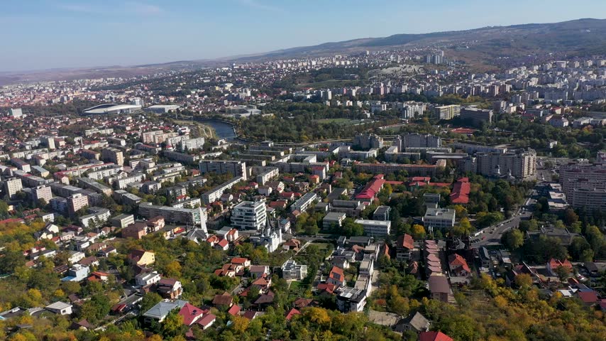 Aerial panoramic view of Cluj-Napoca cityscape with river in Romania