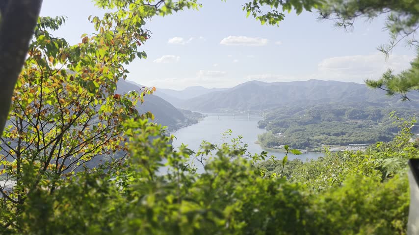 majestic Mountaintop view in nature and a lake view in the distance