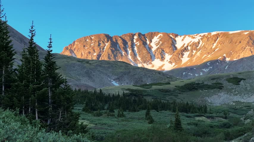Landscape view of Missouri Mountain 14er from Missouri Gulch trailhead Spring Rocky Mountains Collegiate Peaks Colorado Sawatch Range alpine tundra snow morning blue sky sunny nature hiking trail