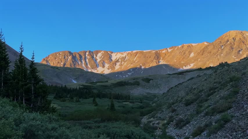 Landscape nature view of Spring in Rocky Mountains Missouri Mountain 14er from Missouri Gulch trailhead Collegiate Peaks Colorado Sawatch Range alpine tundra snow morning sunrise blue sky hiking trail