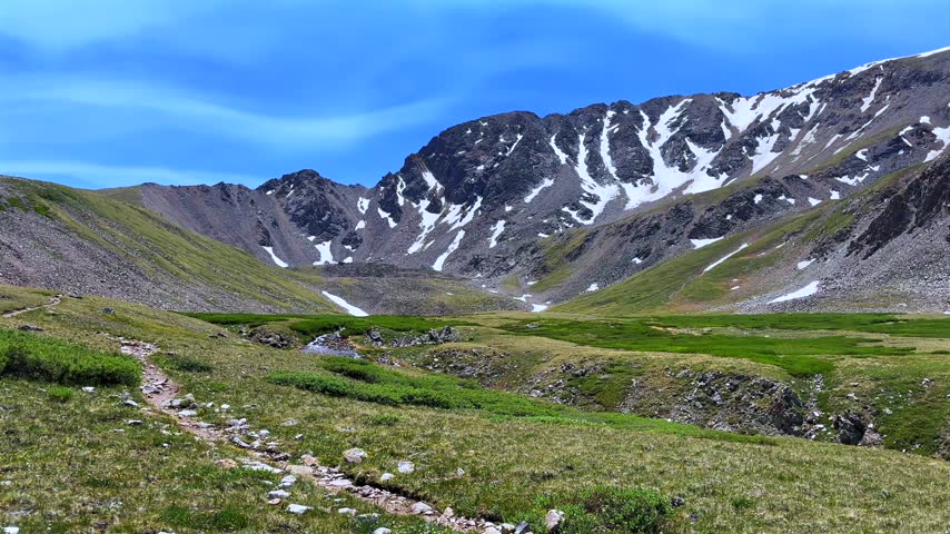 Landscape view of Missouri Gulch trail Elkhead Pass Missouri Mountain Spring Rocky Mountains Collegiate Peaks Colorado Sawatch Range alpine tundra snow morning blue sky sunny nature hiking trail