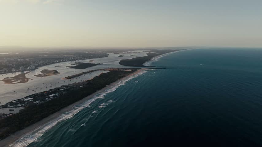 Aerial Drone footage of The Spit lake passage in Gold Coast Australia taken during sunset.