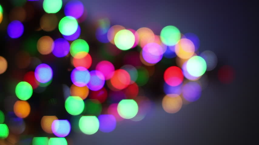 Decorated Christmas tree with fairy lights and hanging ornaments