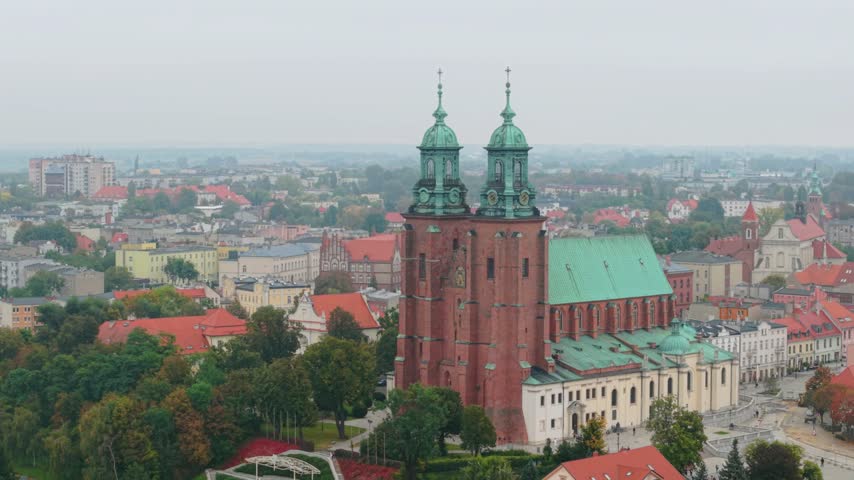 Slow Orbiting Drone View of Gniezno Cathedral and Historic City Center in Autumn, Poland