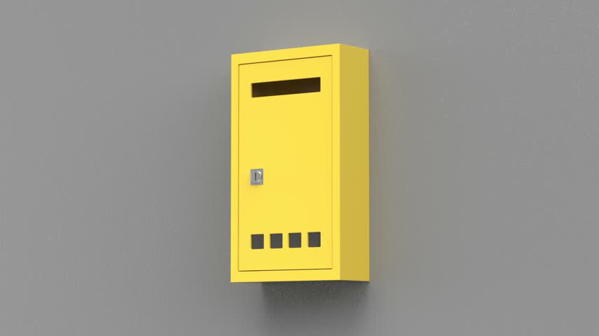 Yellow mailbox on grey wall