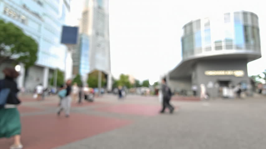 	
Blurred background of urban plaza pedestrian stroller beside modern building in Yokohama, Japan