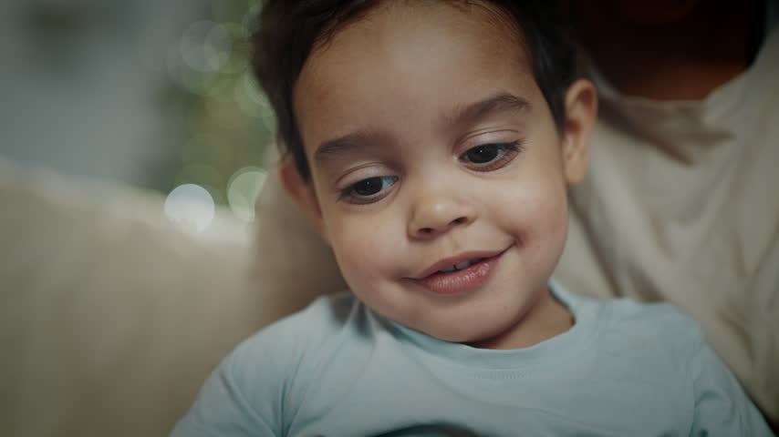Portrait of cute African American baby, little boy with big black eyes, closeup. Happy childhood and parenthood, healthy child in family, African American ethnicity, diversity of people, be yourself