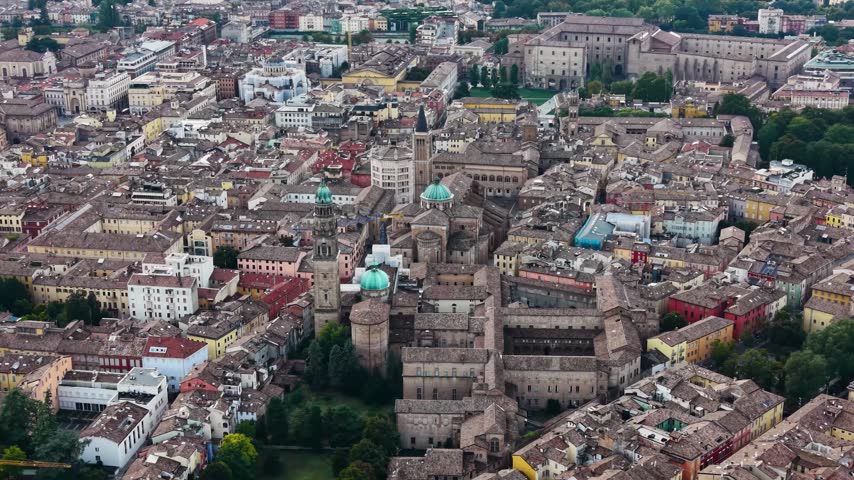 A panoramic aerial view above the old town and city Parma in Italy, on a cloudy  day in autumn 