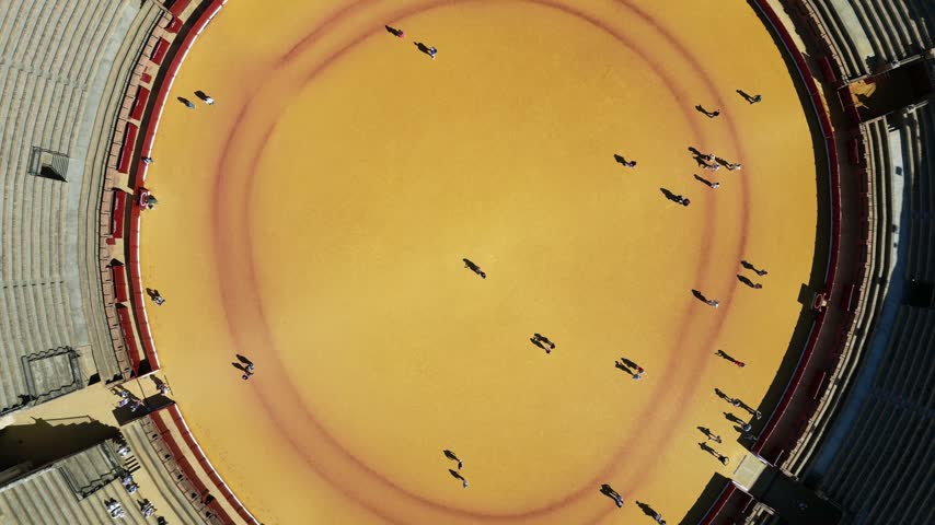 The video shows the Plaza de Toros de la Real Maestranza de Caballería de Sevilla (the Maestranza bullring), located in the Arenal district of Seville, Spain.
A top-down drone shot that then rotates at the end.
• Architecture: An iconic Late Baroque-style building, characterized by its white and ochre façade and a slightly oval shape that is unique in Spain.
• Capacity: Approximately 12,500 seats.
• History: Construction began in 1761 and spanned more than a century. It is one of the country