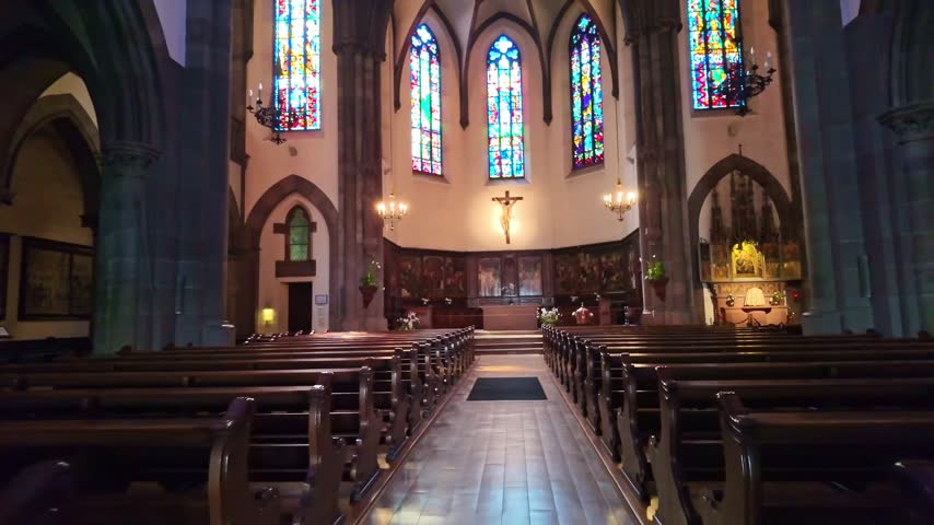 Nave of Saint Pierre le Vieux church in Strasbourg with camera moving forward