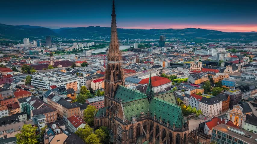 Aerial View of Linz Austria at Sunrise Featuring New Cathedral Mariendom and Gothic Architecture