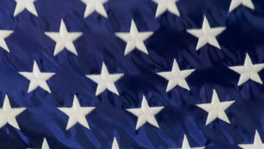 Macro HD video of American flag waving in the breeze, NOT computer generated